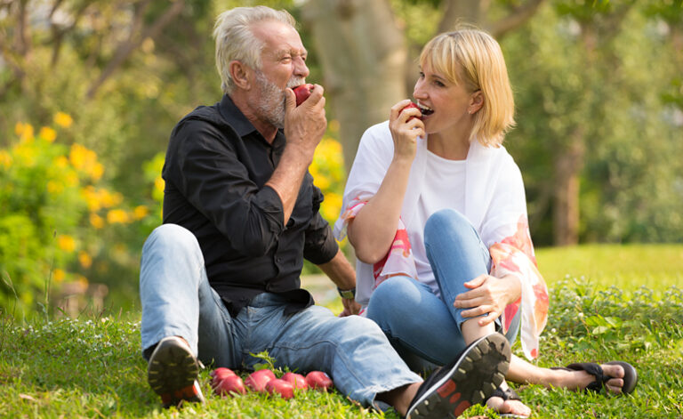 Couple enjoying the outdoors and living a healthy lifestyle to improve their mental health