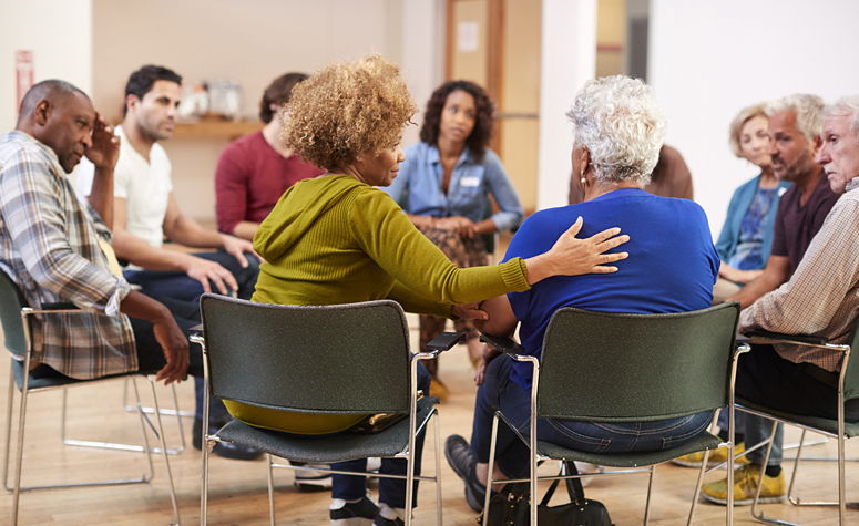 Group session of psychotherapy in addiction rehab and recovery center