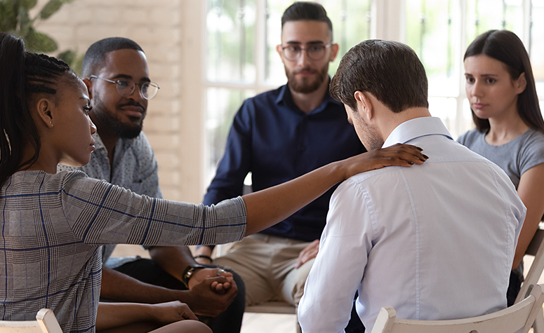 Group therapy session in rehab treatment clinic