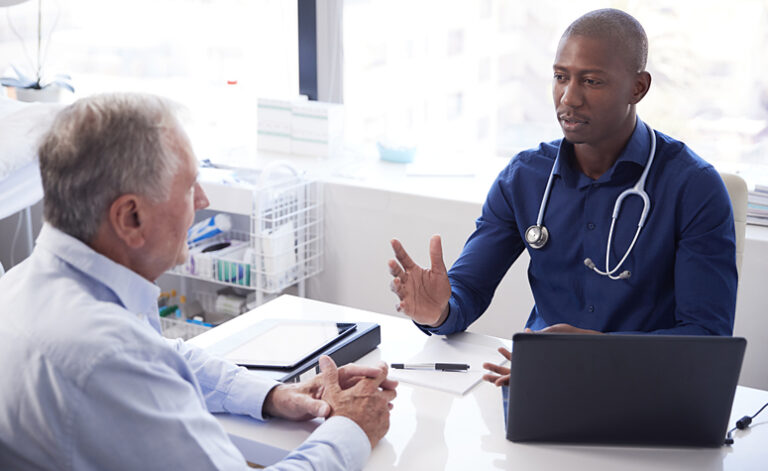 Man visiting his GP to discuss his symptoms of depression and work out a treatment plan