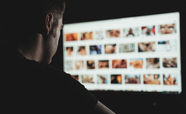 Porn addict surfing the internet at night