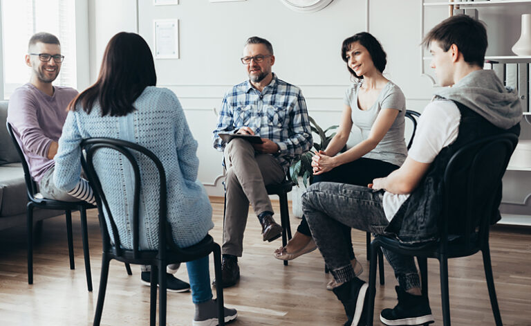 Group therapy session taking place at a treatment centre
