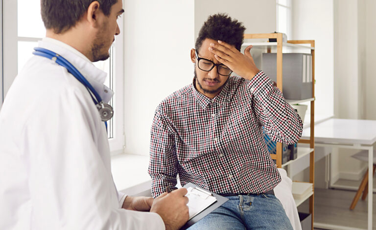 Man visiting GP regarding numerous illnesses he is worried about