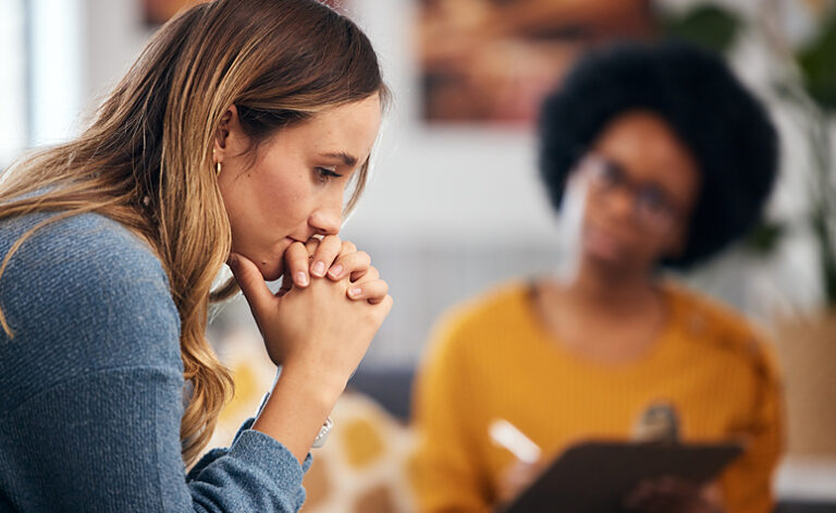Women discussing seasonal affective disorder during CBT treatment therapy