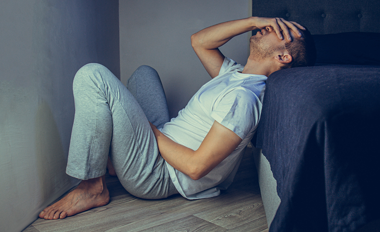 Man having withdrawal symptoms during heroin detox